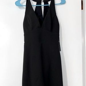 Never worn , slim black dress size S